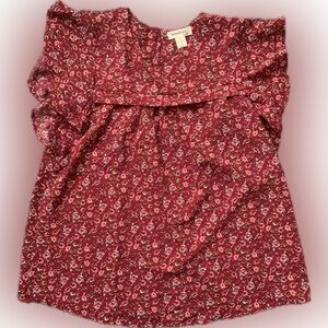 Flowy blouse with flutter sleeves and keyhole back closure.